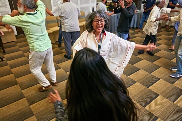 Participants dancing in the session room