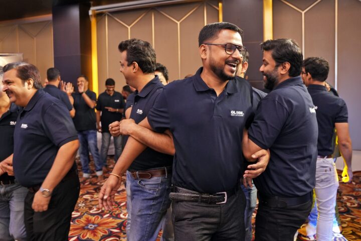 Participants greeting one another in the middle of the crowd