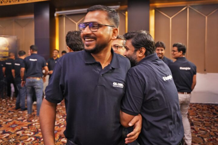 A participant smiling in the middle of the group